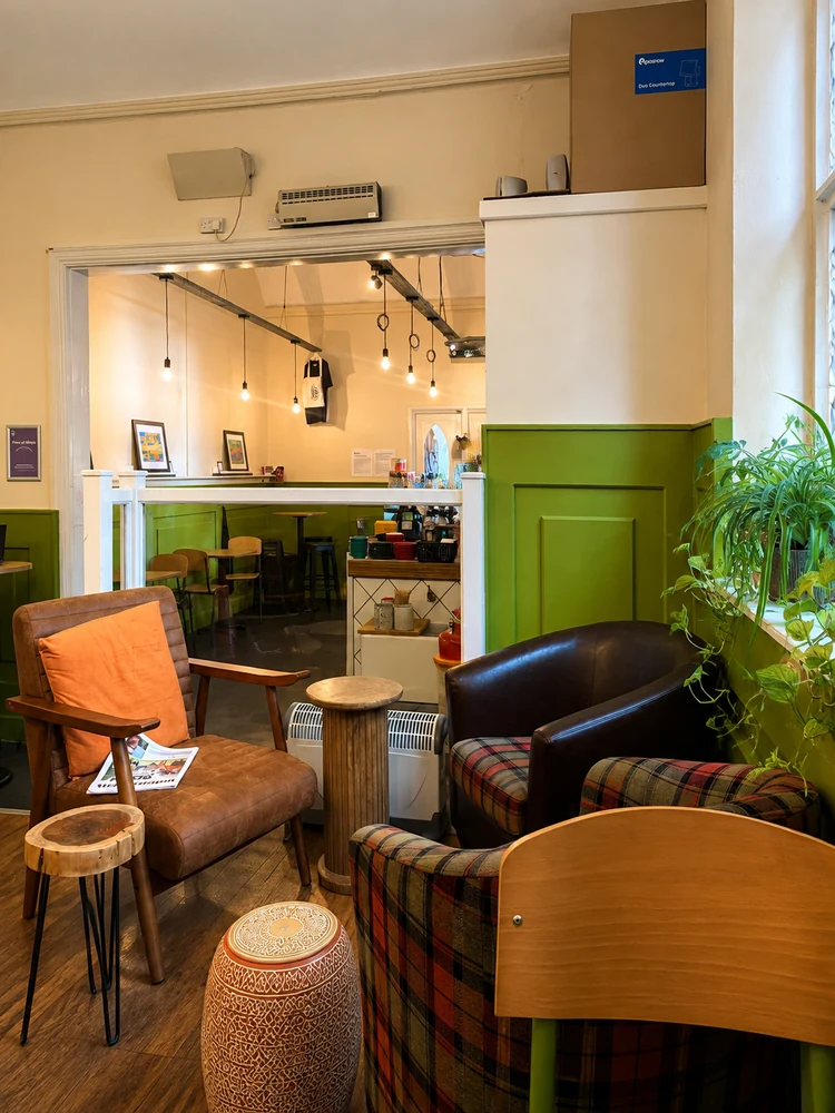 The seating area and warm interior inside Vestry Hall Coffee